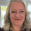 Clare Timms, King's College Cambridge - a headshot of a blonde hair professional woman