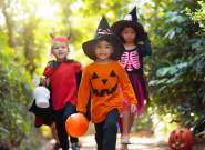 3 children in Halloween costumes walking - Credit Canva Stock Images