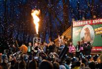 Huge crowd looking up at a stage that reads Gobblers Knob with people cheering and a blast of fire is coming out of a section of the stage