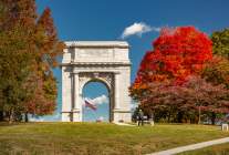 Valley Forge National Historical Park in King of Prussia with fall foliage filled trees standing around the iconic arch.