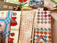quilts hanging on wall