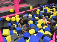 boy and girl playing in large foam blocks