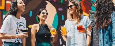 women enjoying cocktails