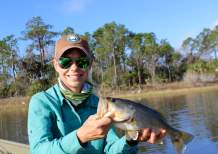 Outdoor writer and freshwater fishing guide Debbie Hanson shows off a bass caught in Webb Lake.