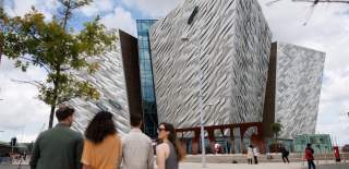 Group walking towards Titanic Belfast