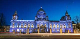 Belfast city hall lit up at night