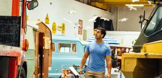 A man walking through Coventry Transport Museum