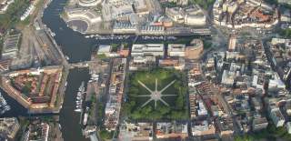 An aerial view of central Bristol landmarks, including the Harbourside and Queen Square