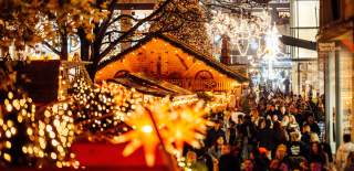 Christmas lights and stalls with Cabot in background - Credit James Bridle