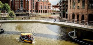 A Bristol Ferry Boat sailing under Castle Bridge in Finzels Reach, towards Bristol's Harbourside