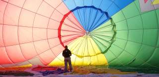 A balloon being inflated by an attendant at Bristol International Balloon Fiesta - credit Paul Box