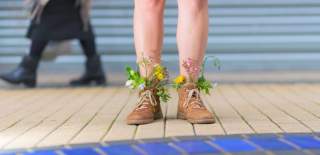 Person standing with leaves in their boots - credit Paul Blakemore