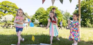Children playing outside in sunshine at Bristol Zoo Project - credit Bristol Zoo Project