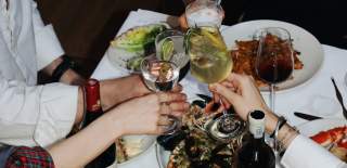 People with wine and cocktails at 1 York Place - credit Studio Merkai