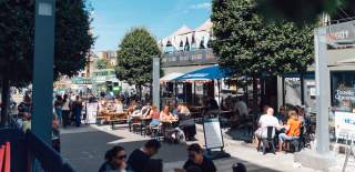 People dining alfresco at Wapping Wharf on Bristol's Harbourside - credit Shotaway