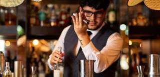Bartender prepares a cocktail at Rick's Bar on Bristol's Harbourside - credit Rick's