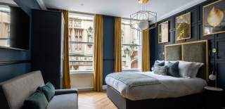 A bedroom with Guildhall view at Hort's Townhouse in Bristol - credit Youngs