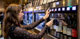 Woman choosing wine from Enomatic machine at Le Vignoble Bristol - credit Le Vignoble