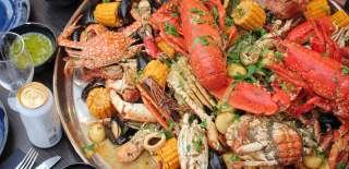 Seafood boil platter with dips and drinks - credit Fisk & Frite