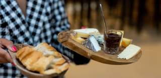 Person holding cheese selection at Le Vignoble Bristol - credit Le Vignoble