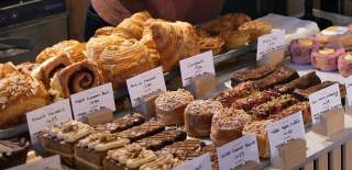 Selection of Pinkmans cakes and pastries on counter - credit Pinkmans
