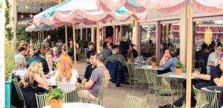 People sat on sunny front terrace at Ritorno Lounge in Bristol - credit Loungers