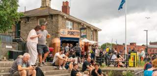 People sat outside The Cottage Inn