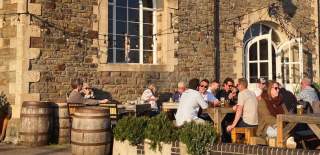 People sat on the front terrace at The Pump House in Bristol