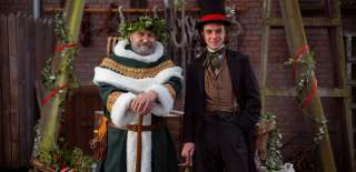 Father Christmas and Brunel stoods infront of a Christmas backdrop - Credit Brunel's SS Great Britain