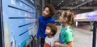 Children reading a sign inside the Concorde Hangar at Aerospace Bristol - credit Aerospace Bristol