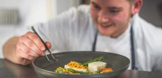 Chef plating up food at No. 4 Clifton Village in Bristol - credit Evoke Pictures