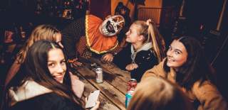 A group of friends with a clown at FEAR scream park