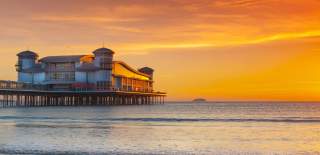 A view of the Grand Pier in Weston-super-Mare near Bristol at sunset - credit Dave Peters