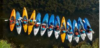 A group of people kayaking at Mendip Activity Centre, near Bristol - credit Mendip Activity Centre