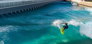 A surfer riding a wave at The Wave inland surfing lake near Bristol - credit The Wave