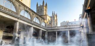 An wide shot of the Great Bath at The Roman Baths in central Bath, near Bristol