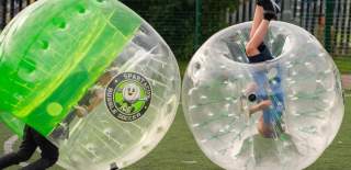 Two boys inside zorb footballs at Spartacus Bubble Soccer