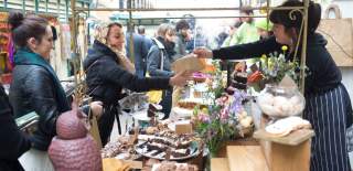 People buying food at St Nicholas Market in Bristol's Old City - credit Paul Box