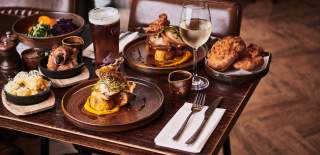 A selection of Sunday roasts on a table at The Maple restaurant in Cleeve, near Bristol - credit The Maple