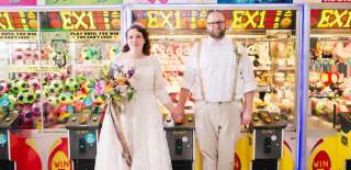 A newly married couple in the arcade at The Grand Pier in Weston-super-Mare near Bristol - credit Charlotte Harris