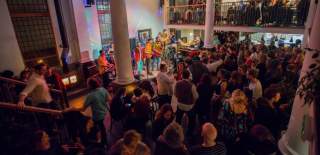 A crowd of people watching a performance inside The Old Market Assembly in East Bristol - credit The Old Market Assembly