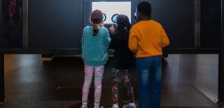 Children looking at an exhibit at the We The Curious science centre in Bristol - credit  Tom Griffiths