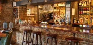 The bar area at The Swan Inn in Rowberrow, near Bristol - credit Butcombe