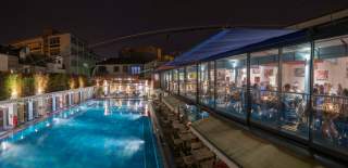 The pool and restaurant at Bristol Lido by night - credit Bristol Lido