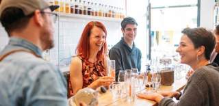 A group of people tasting gin at Psychopomp Microdistillery - Credit Yuup