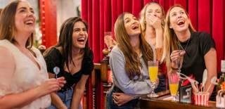 Ladies playing social darts at Flight Club.