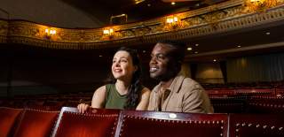 Visitors watching a show at the Everyman Theatre, Cheltenham