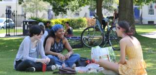 People enjoying a picnic in Cheltenham's parks and gardens.