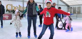 Family ice skating at Cheltenham Ice Rink.