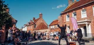 2 Street performers entertaining a crowd